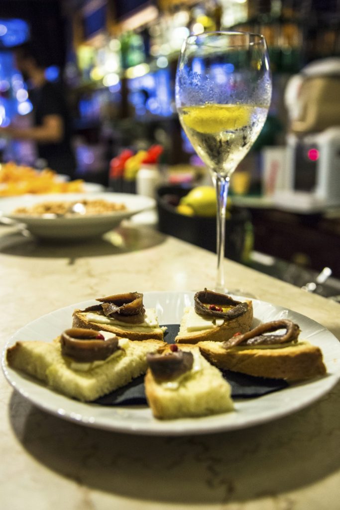 Butter and anchovies on bread at the Caravatti Bar