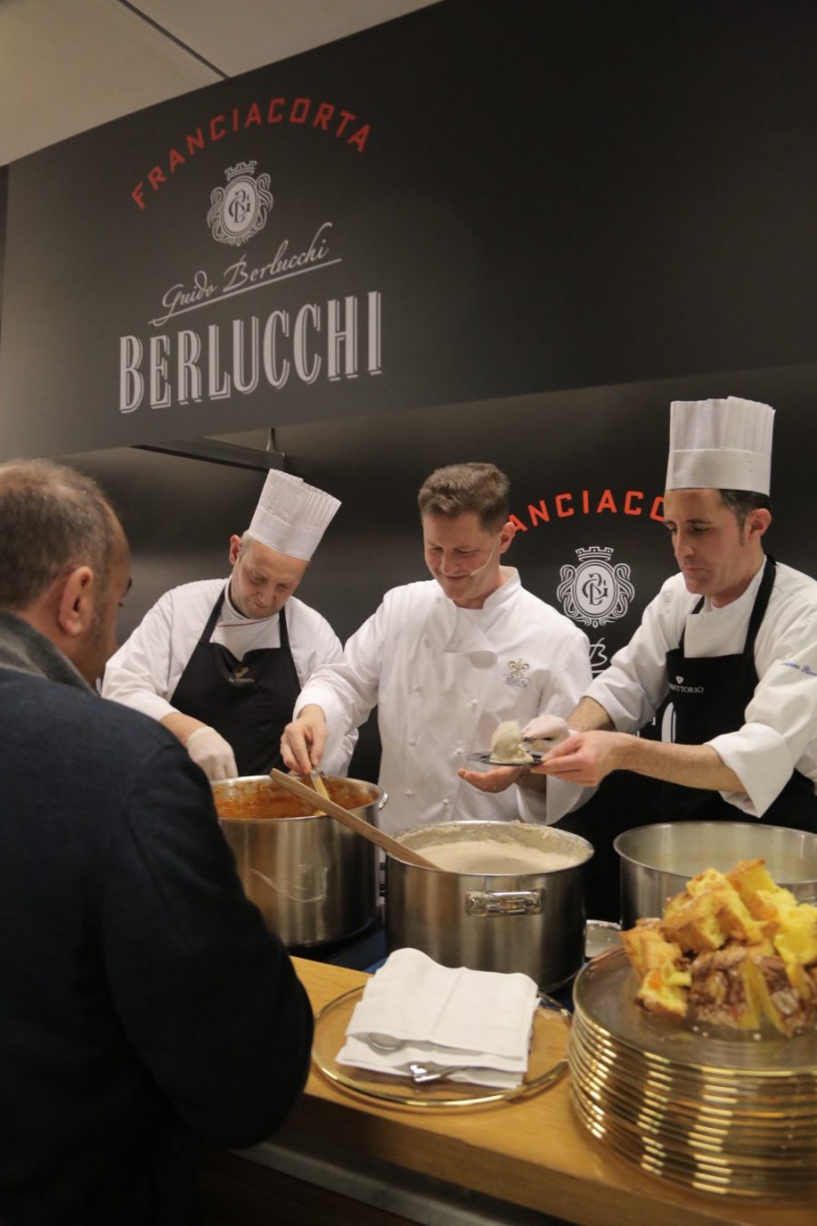 Chicco Cerea and his brigade from Da Vittorio serving guests at the Berlucchi bar in 2016