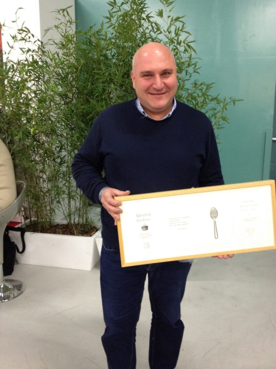 Pietro Zito proudly showing his award